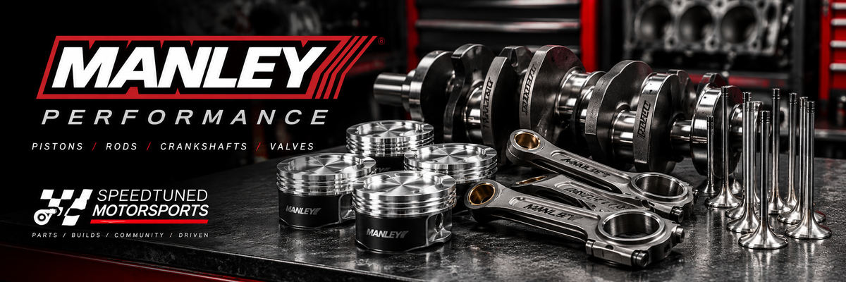 Manley Performance forged pistons, connecting rods, crankshafts, and engine valves displayed in a professional automotive workshop. High-performance engine components for street, track, and racing builds, available at Speed Tuned Motorsports.