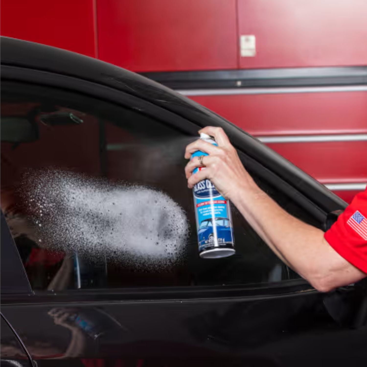 Griots Garage Glass cleaner sprayed at a window